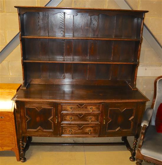 A 1920s Jacobean revival dresser, width 152.5cm, depth 49.5cm, height 188.5cm